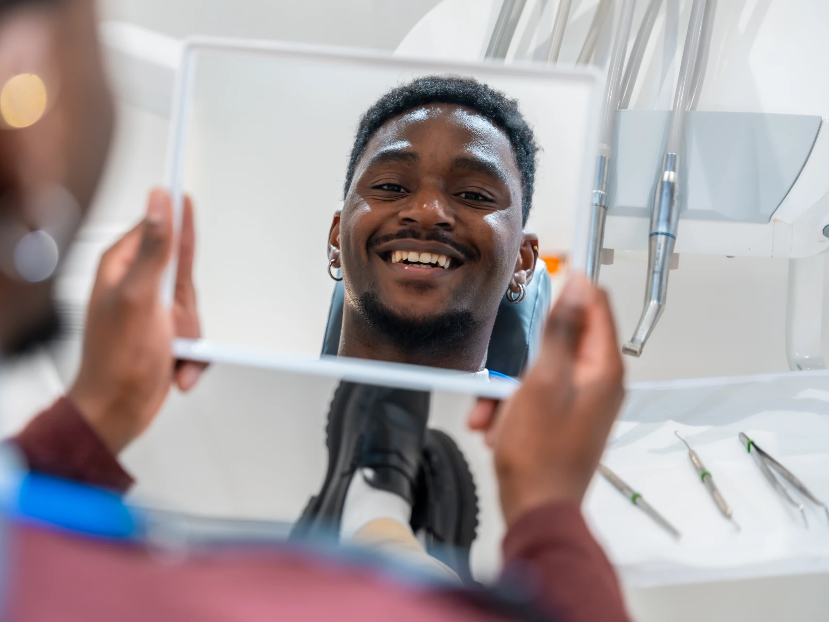 Man smiling after teeth cleaning